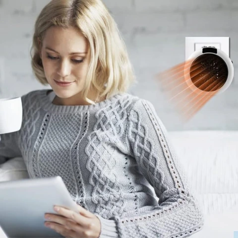 lady drinking coffee on couch getting warm with WonderHeater